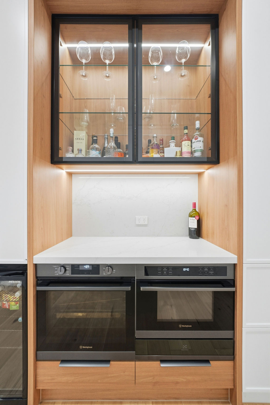 Bar cabinet with glass display and double ovens