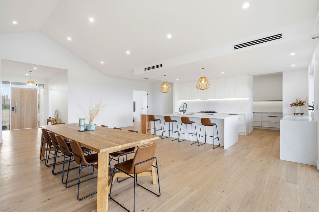Dining and kitchen open plan with timber table