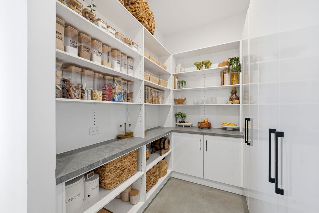 Walk in pantry with floor to ceiling shelving